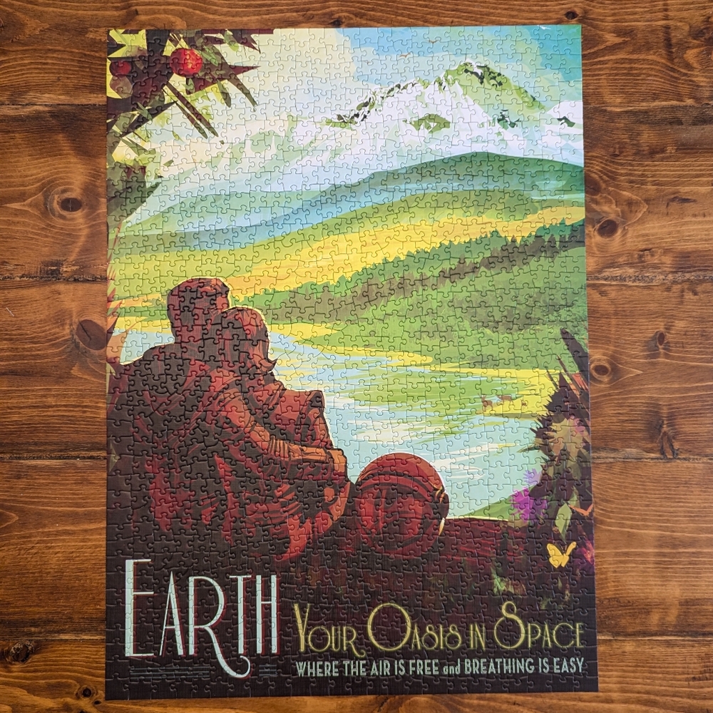 New York Puzzle Company 1000 Piece Puzzle "Earth Your Oasis in Space"